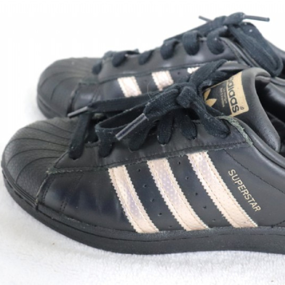 black adidas shoes with rose gold stripes